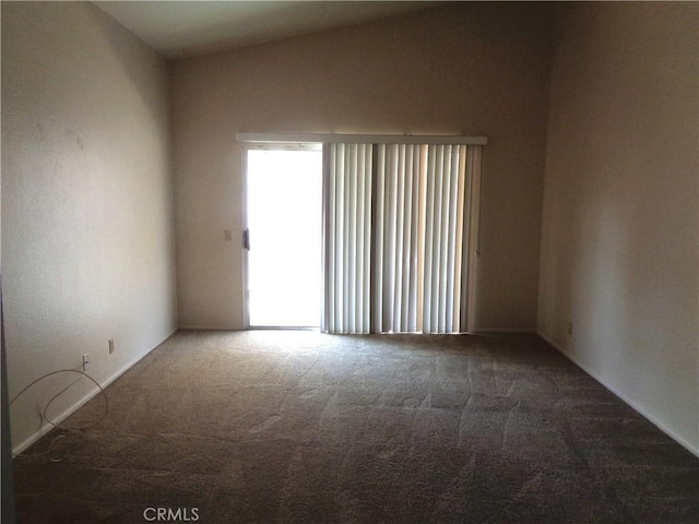 2425 Dixie St, Rosamond, CA 93560 - unfurnished room with carpet floors and vaulted ceiling