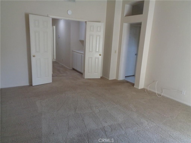2425 Dixie St, Rosamond, CA 93560 - unfurnished bedroom featuring light colored carpet and baseboards