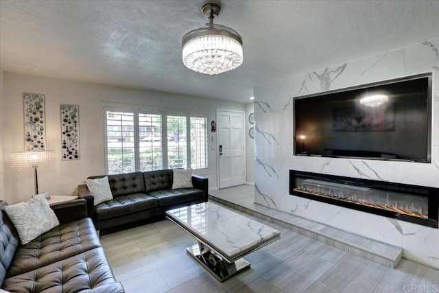 990 E Main St Unit A, El Cajon, CA 92021 - living area featuring a textured ceiling, a chandelier, and a high end fireplace