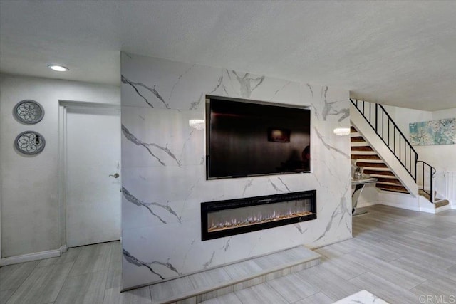 990 E Main St Unit A, El Cajon, CA 92021 - detailed view of a fireplace, a textured ceiling, and recessed lighting