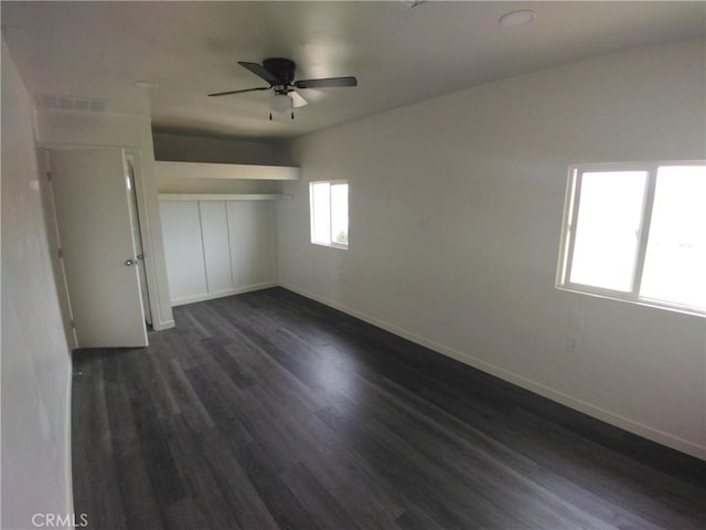 40575 Summerset Rd, Newberry Springs, CA 92365 - unfurnished bedroom with dark wood-type flooring, a closet, and ceiling fan