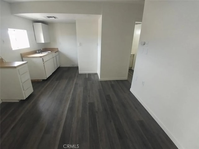 40575 Summerset Rd, Newberry Springs, CA 92365 - kitchen featuring dark wood finished floors, white cabinetry, and light countertops