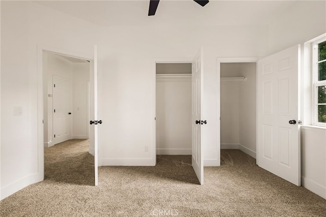255 Sparrow Ct, Red Bluff, CA 96080 - unfurnished bedroom featuring light colored carpet, two closets, and ceiling fan