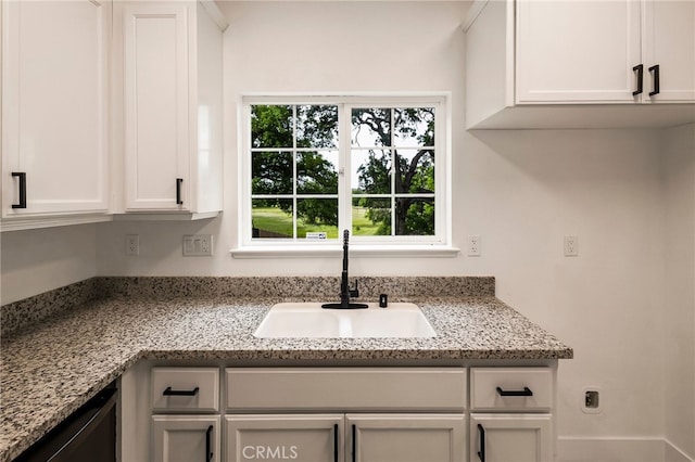 255 Sparrow Ct, Red Bluff, CA 96080 - kitchen featuring white cabinets, light stone countertops, and dishwasher