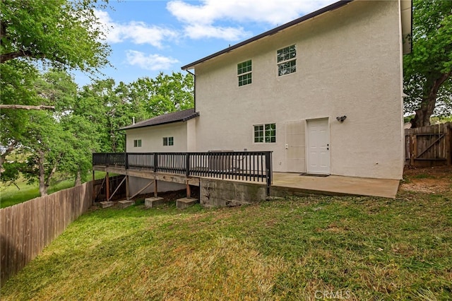 255 Sparrow Ct, Red Bluff, CA 96080 - rear view of house featuring a fenced backyard, stucco siding, and a wooden deck