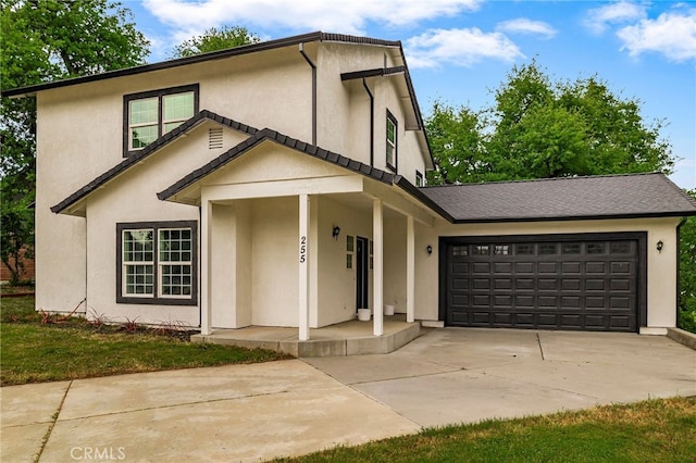 255 Sparrow Ct, Red Bluff, CA 96080 - view of front facade featuring concrete driveway, stucco siding, a porch, and a garage