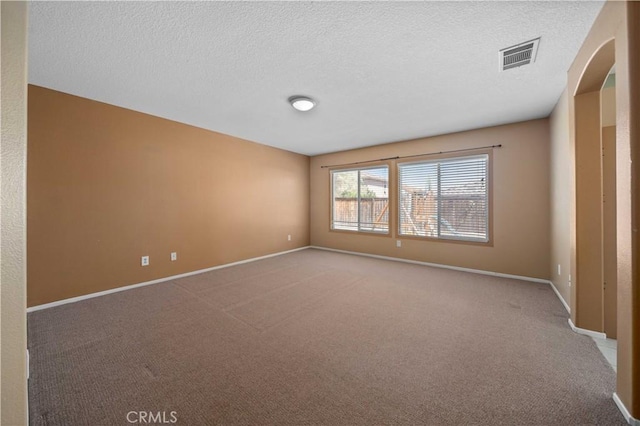 5715 Malaga Ct, Palmdale, CA 93552 - carpeted spare room featuring a textured ceiling and arched walkways