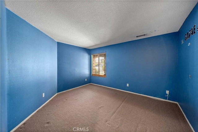 5715 Malaga Ct, Palmdale, CA 93552 - spare room with a textured ceiling and carpet