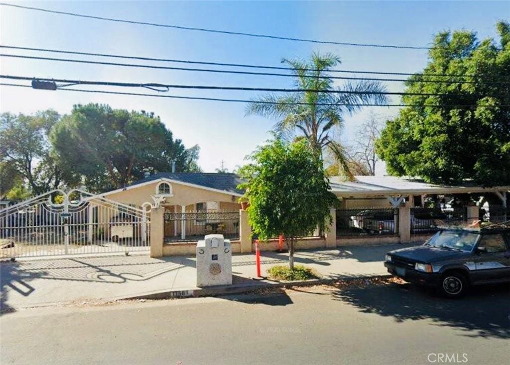 11361 Eldrige Ave, Sylmar, CA 91342 - view of front of home with a fenced front yard