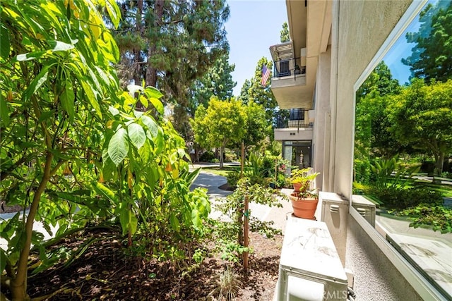 2385 Via Mariposa Unit 1F, Laguna Woods, CA 92637 - view of yard featuring a balcony