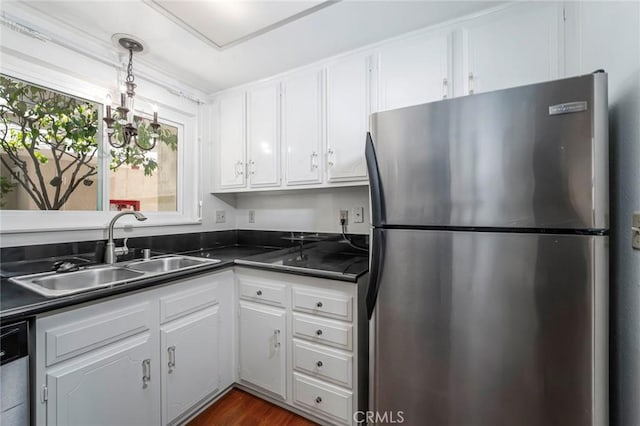 2385 Via Mariposa Unit 1F, Laguna Woods, CA 92637 - kitchen with stainless steel appliances, dark countertops, white cabinetry, and pendant lighting