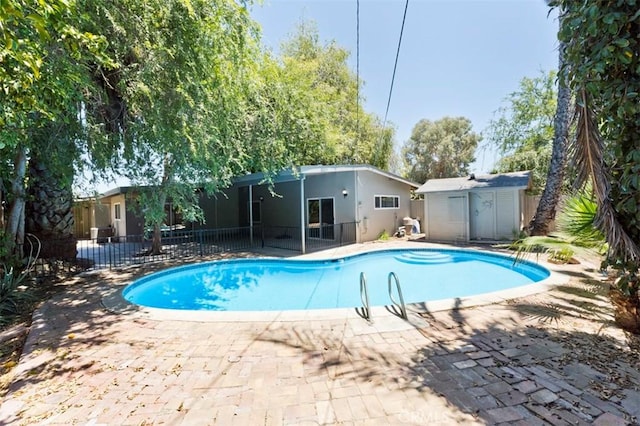 4001 Rinker Way, Bakersfield, CA 93309 - view of swimming pool featuring a shed and a patio