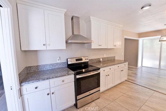4001 Rinker Way, Bakersfield, CA 93309 - kitchen with stainless steel electric range, wall chimney range hood, white cabinets, and light stone counters