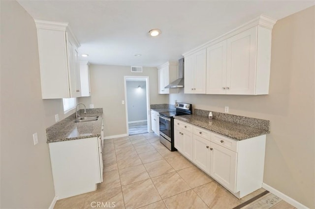 4001 Rinker Way, Bakersfield, CA 93309 - kitchen featuring stainless steel range with electric stovetop, wall chimney exhaust hood, white cabinetry, dark stone counters, and recessed lighting