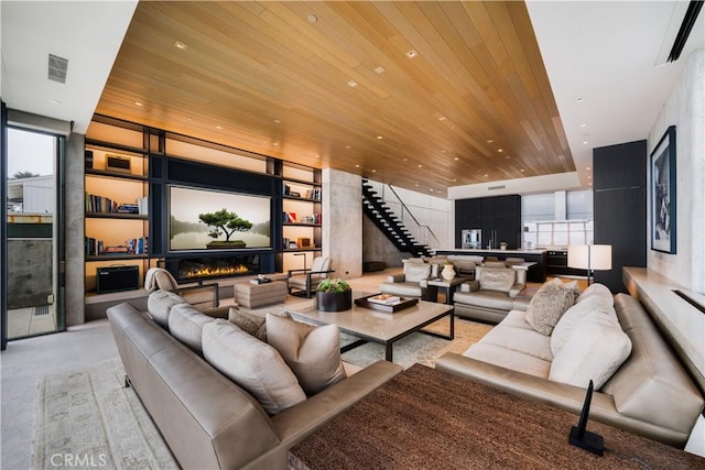 35411 Beach Rd, Dana Point, CA 92624 - living room featuring wood ceiling, a glass covered fireplace, healthy amount of natural light, stairway, and recessed lighting