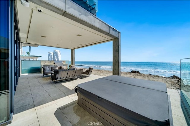 35411 Beach Rd, Dana Point, CA 92624 - view of patio / terrace with a hot tub, an outdoor living space, and view of water and beach