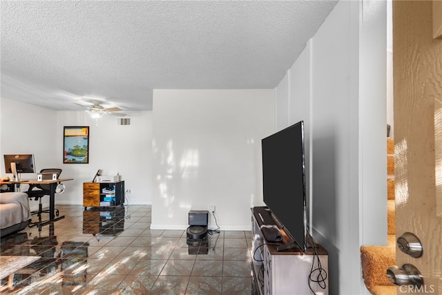 8718 Willis Ave Unit 34, Panorama City, CA 91402 - living area featuring a ceiling fan, a textured ceiling, and a desk