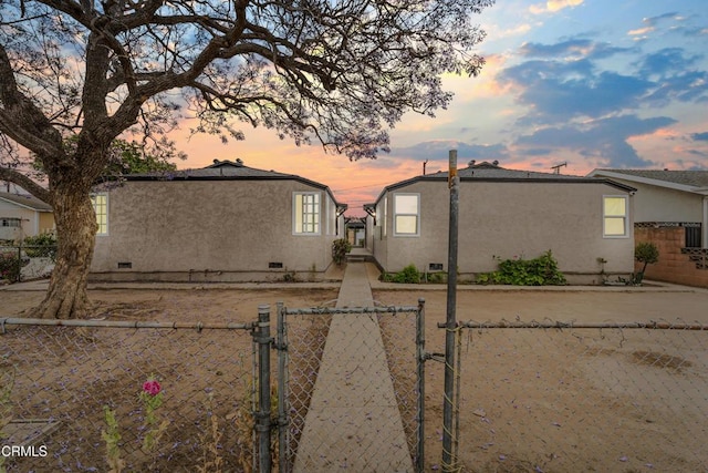 136 N Garfield Ave, Oxnard, CA 93030 - view of front facade with a gate, stucco siding, and crawl space