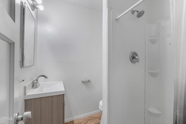 136 N Garfield Ave, Oxnard, CA 93030 - full bathroom featuring vanity, curtained shower, and wood finished floors