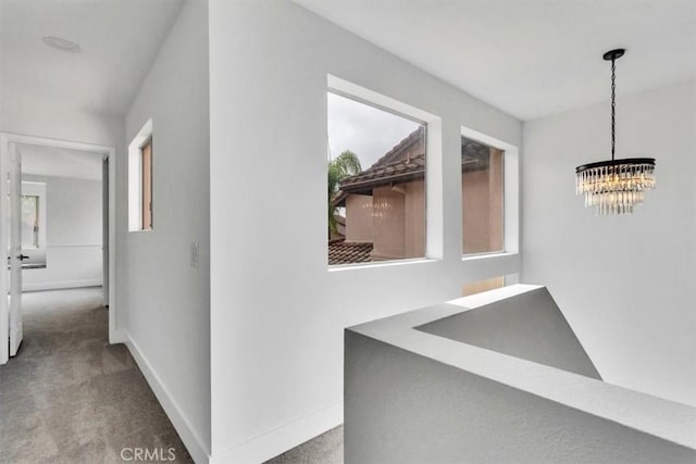 37 Conch Reef, Aliso Viejo, CA 92656 - hall featuring a chandelier, carpet floors, and plenty of natural light
