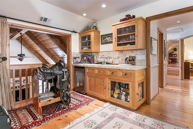 28971 N Shore Rd, Lake Arrowhead, CA 92352 - bar featuring light wood-type flooring, refrigerator, tasteful backsplash, a ceiling fan, and recessed lighting