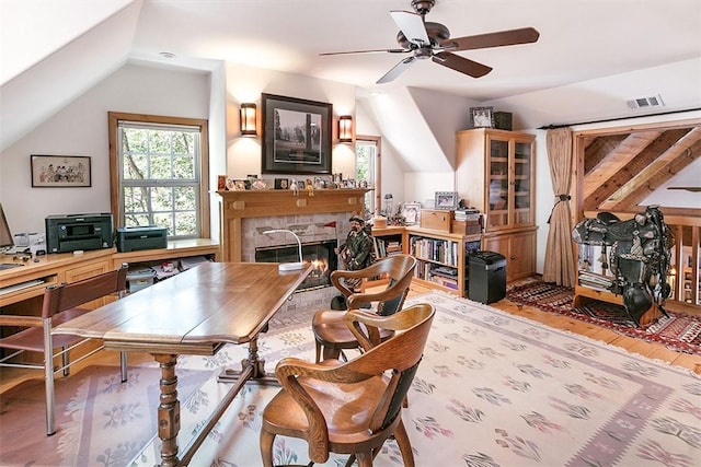 28971 N Shore Rd, Lake Arrowhead, CA 92352 - office with lofted ceiling, a tiled fireplace, wood finished floors, and a ceiling fan