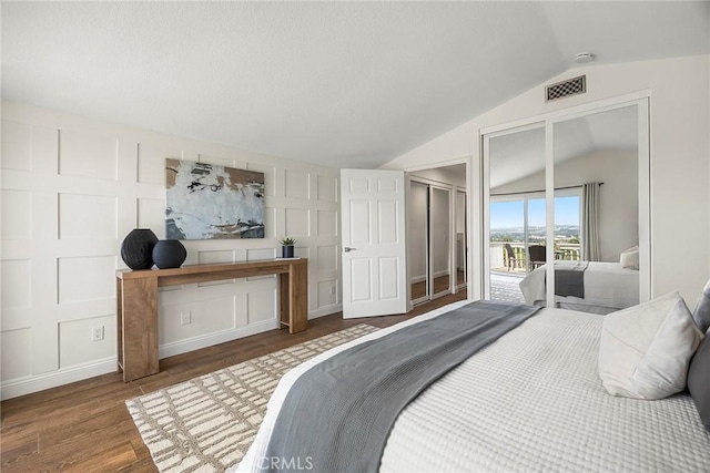 28245 Via Alfonse, Laguna Niguel, CA 92677 - bedroom featuring lofted ceiling, access to exterior, wood finished floors, and a decorative wall