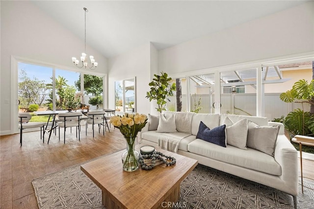 28245 Via Alfonse, Laguna Niguel, CA 92677 - living room featuring a chandelier, high vaulted ceiling, and wood finished floors