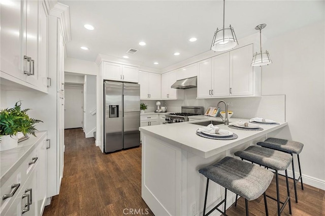 28245 Via Alfonse, Laguna Niguel, CA 92677 - kitchen with stainless steel fridge, exhaust hood, stove, white cabinetry, and a peninsula