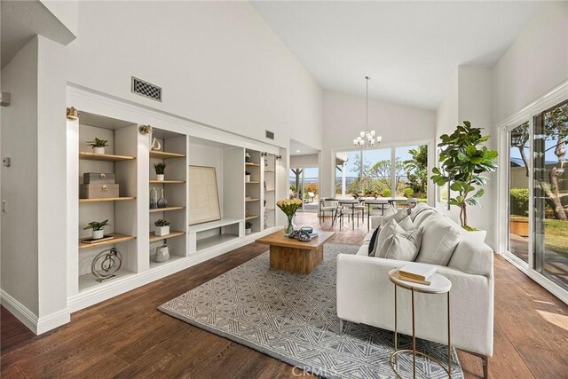 28245 Via Alfonse, Laguna Niguel, CA 92677 - living room featuring a chandelier, wood finished floors, high vaulted ceiling, and built in features