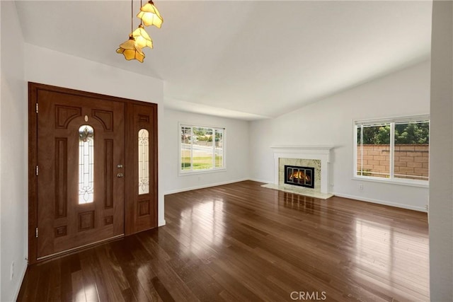 8291 Jennet St, Rancho Cucamonga, CA 91701 - foyer entrance with lofted ceiling, healthy amount of natural light, dark wood finished floors, and a fireplace