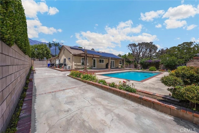 8291 Jennet St, Rancho Cucamonga, CA 91701 - view of swimming pool with a patio area and a mountain view