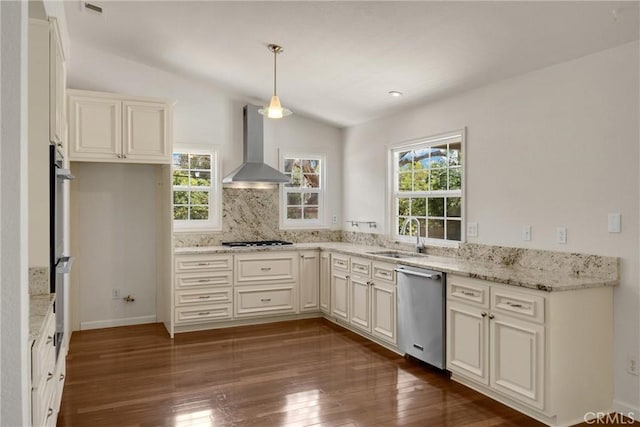 8291 Jennet St, Rancho Cucamonga, CA 91701 - kitchen with wall chimney exhaust hood, stainless steel appliances, dark wood-style flooring, light stone countertops, and pendant lighting