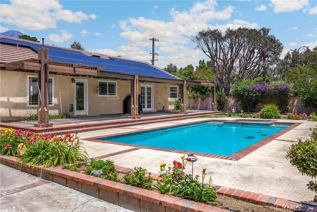 8291 Jennet St, Rancho Cucamonga, CA 91701 - view of swimming pool featuring french doors, a patio area, and a fenced backyard