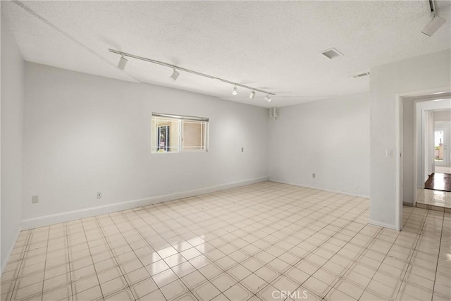 8291 Jennet St, Rancho Cucamonga, CA 91701 - unfurnished room featuring track lighting and a textured ceiling