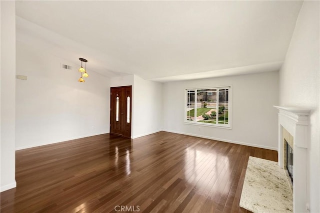 8291 Jennet St, Rancho Cucamonga, CA 91701 - unfurnished living room featuring dark wood finished floors and a fireplace with flush hearth