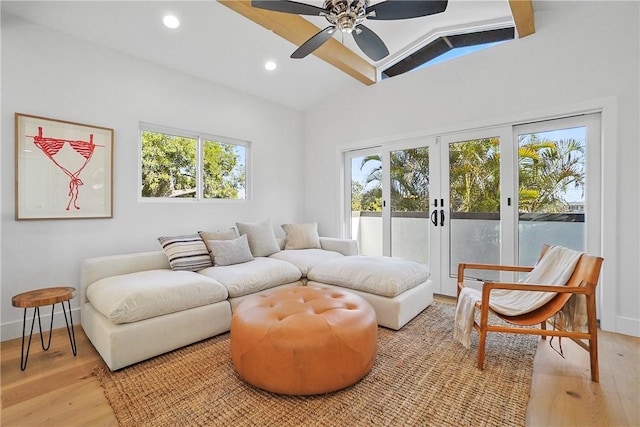 3119 Gibraltar Ave, Costa Mesa, CA 92626 - living room with healthy amount of natural light, light wood finished floors, a ceiling fan, vaulted ceiling, and recessed lighting