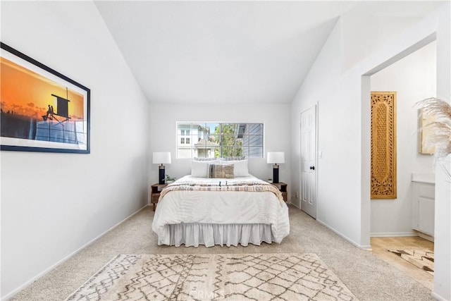 18051 Wakefield Ln Unit 106, Huntington Beach, CA 92648 - carpeted bedroom featuring lofted ceiling and baseboards