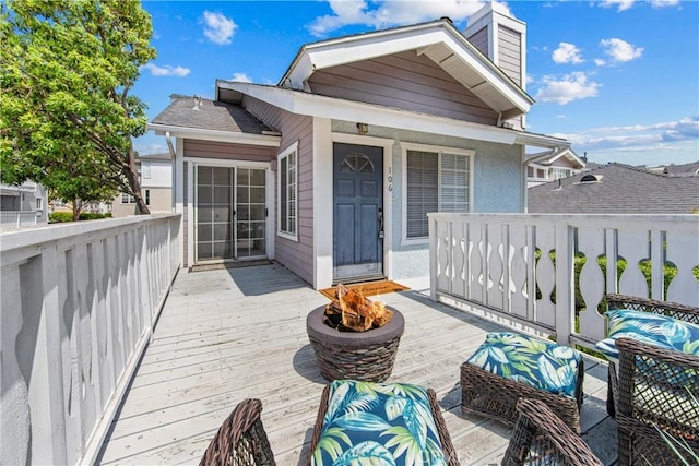 18051 Wakefield Ln Unit 106, Huntington Beach, CA 92648 - wooden deck featuring an outdoor fire pit