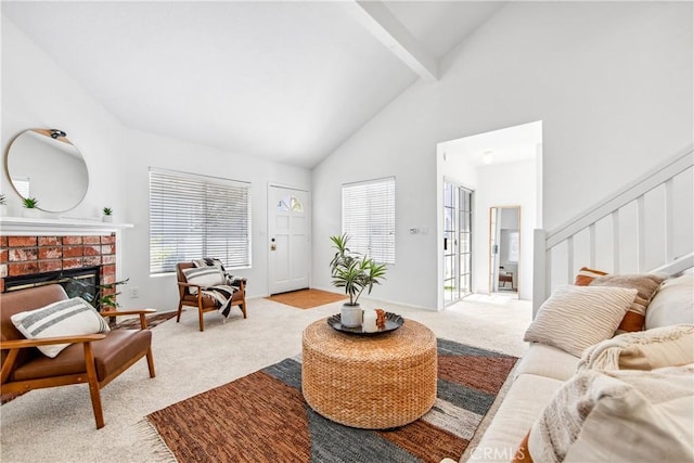 18051 Wakefield Ln Unit 106, Huntington Beach, CA 92648 - living area featuring light carpet, high vaulted ceiling, beam ceiling, a brick fireplace, and stairs