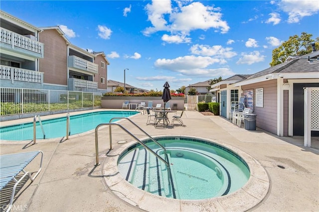 18051 Wakefield Ln Unit 106, Huntington Beach, CA 92648 - community pool with a hot tub, a patio, and a residential view