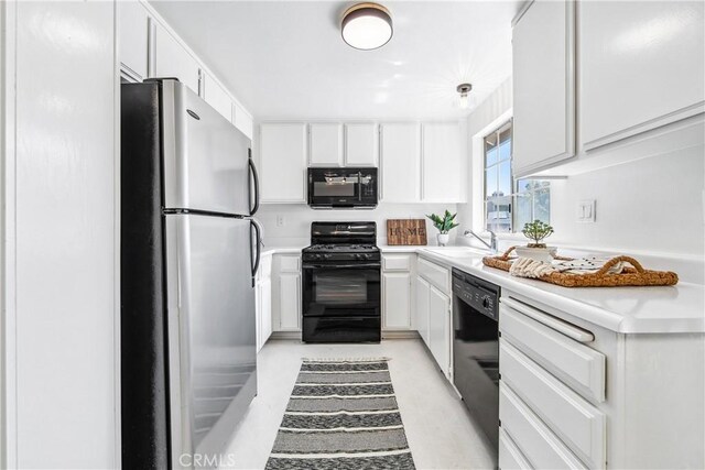 18051 Wakefield Ln Unit 106, Huntington Beach, CA 92648 - kitchen with black appliances, white cabinets, and light countertops