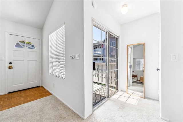 18051 Wakefield Ln Unit 106, Huntington Beach, CA 92648 - foyer featuring healthy amount of natural light and vaulted ceiling