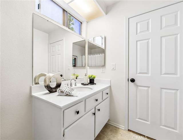 18051 Wakefield Ln Unit 106, Huntington Beach, CA 92648 - full bathroom with vanity and baseboards