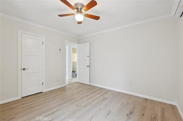 2422 E 115th St, Los Angeles, CA 90059 - empty room with an AC wall unit, wood finished floors, ceiling fan, and crown molding