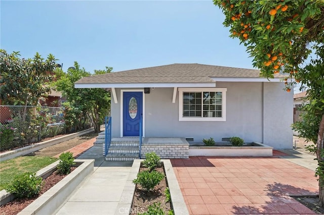 2422 E 115th St, Los Angeles, CA 90059 - view of front of home with covered porch, stucco siding, and roof with shingles