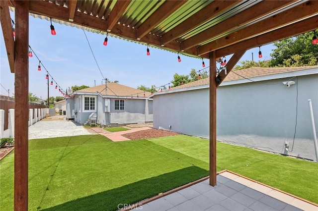 2422 E 115th St, Los Angeles, CA 90059 - fenced backyard with a patio area