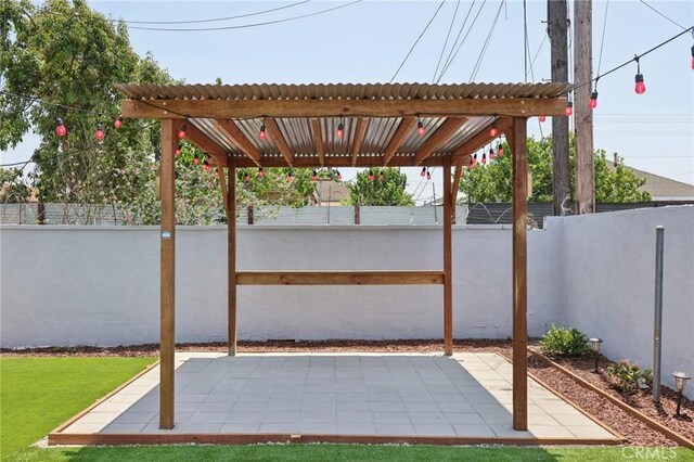 2422 E 115th St, Los Angeles, CA 90059 - fenced backyard with a patio and a pergola