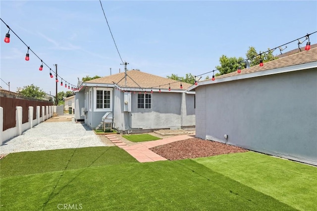 2422 E 115th St, Los Angeles, CA 90059 - back of property with a patio and stucco siding