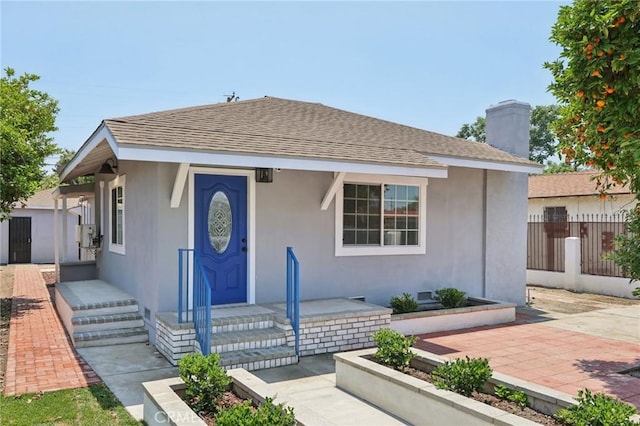 2422 E 115th St, Los Angeles, CA 90059 - bungalow with roof with shingles and stucco siding